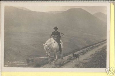 Shepherd Carring Sheep on Horseback