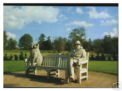 Stone Sheep and Man on a Park Bench