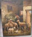 Man Feeding Sheep in a Barn