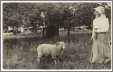 Photo of Woman with Sheep on a Leash